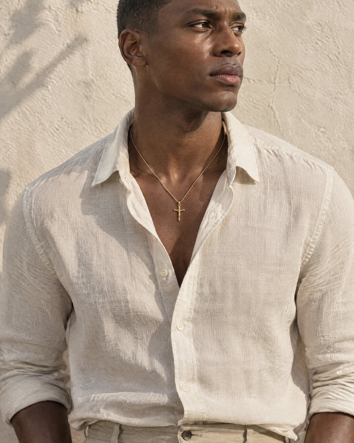 Man wearing the Jesus Cross (Gold) pendant