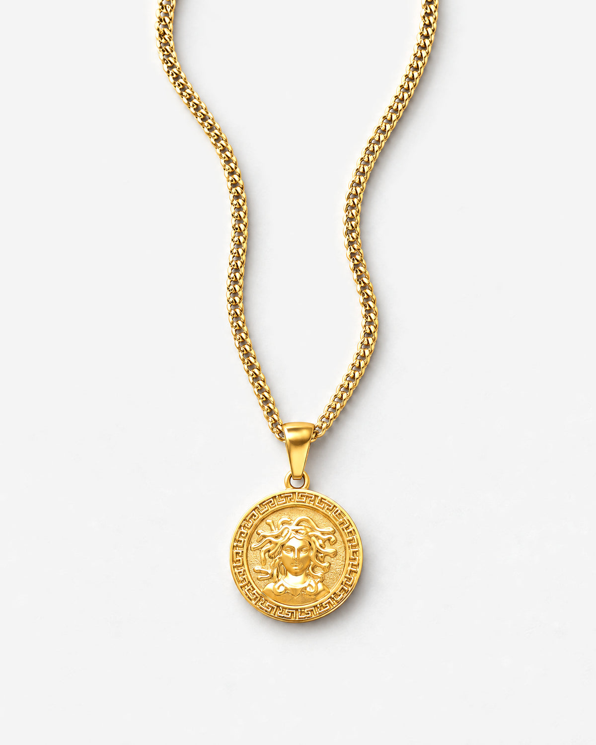 Medusa (Gold) pendant laid flat, close up